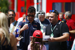 Daniel Ricciardo, Red Bull Racing, signs autographs for fans