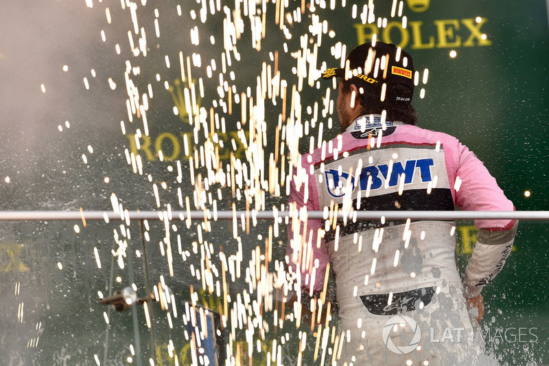 Third place Sergio Perez, Force India celebrates on the podium with the champagne