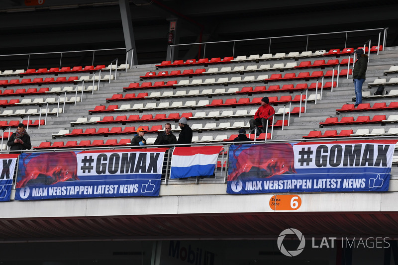 Max Verstappen, Red Bull Racing fans and banners