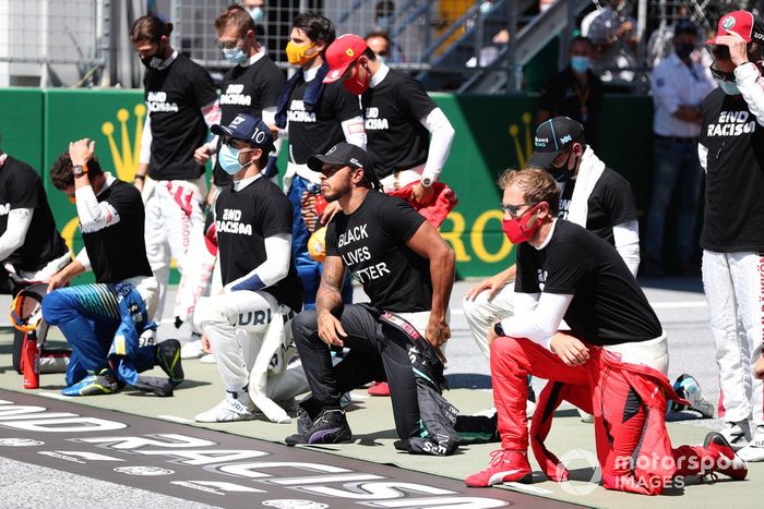 Lewis Hamilton, Mercedes-AMG Petronas F1, and the drivers take a knee on the grid