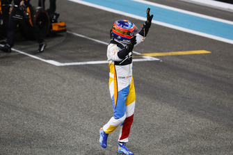 Fernando Alonso, McLaren, waves to the fans after completing his final race in F1