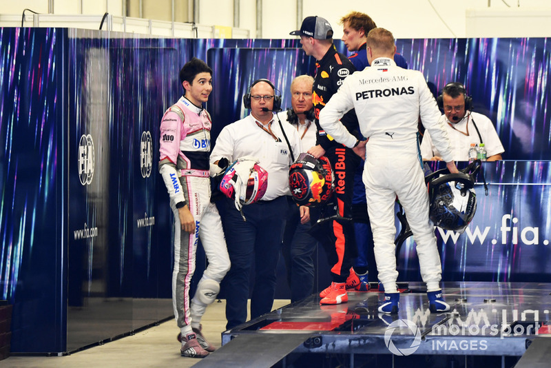 Max Verstappen, Red Bull Racing and Esteban Ocon, Racing Point Force India square up after the race following their on track crash 