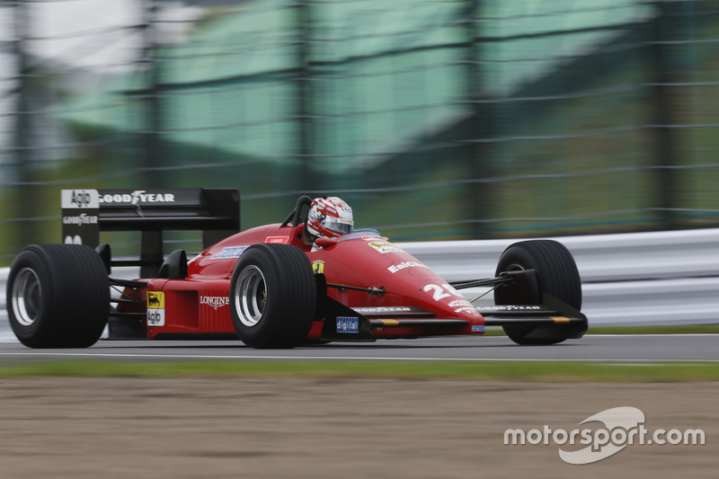 A classic Ferrari performs in a demo run