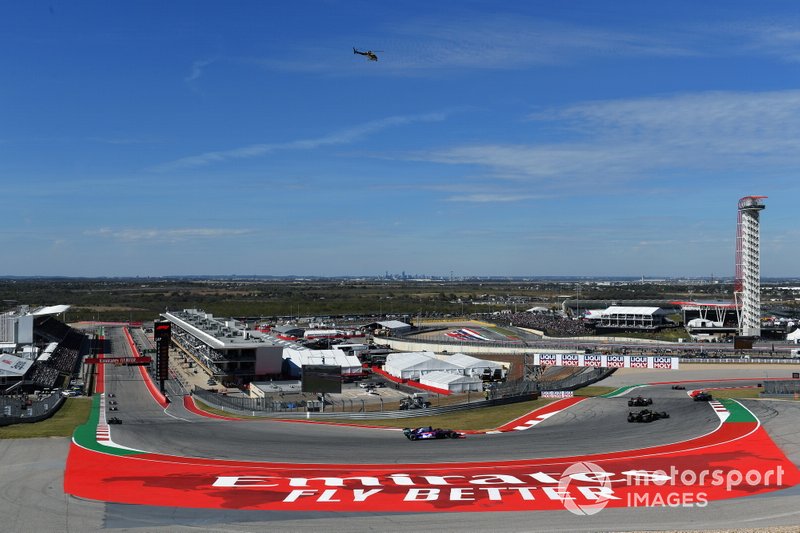 Kimi Raikkonen, Alfa Romeo Racing C38, leads Nico Hulkenberg, Renault F1 Team R.S. 19, Daniil Kvyat, Toro Rosso STR14, and Romain Grosjean, Haas F1 Team VF-19