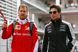 (L to R): Sebastian Vettel, Ferrari with Sergio Perez, Sahara Force India F1