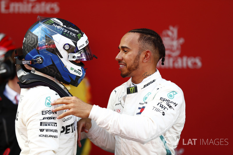 Lewis Hamilton, Mercedes AMG F1, celebrates victory in parc ferme with Valtteri Bottas, Mercedes AMG F1