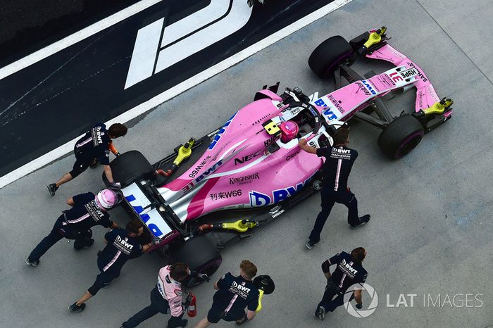 Esteban Ocon, Force India VJM11 is pushed in pit lane