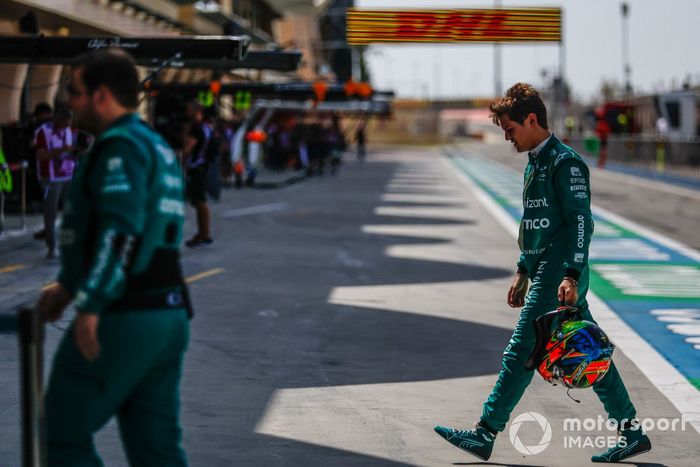 Felipe Drugovich, Aston Martin F1 Team, walks back to the garage after his car stopped on track