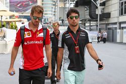 (L to R): Sebastian Vettel, Ferrari with Sergio Perez, Sahara Force India F1
