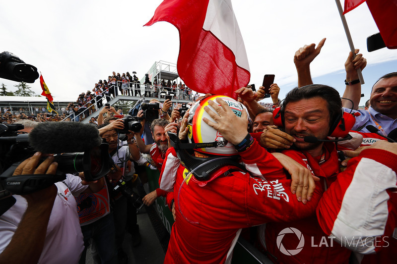 Sebastian Vettel, Ferrari, celebrates victory with his team in parc ferme