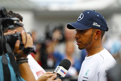 Lewis Hamilton, Mercedes AMG F1, speaks to the media