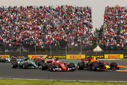 Max Verstappen, Red Bull Racing RB13 leads at the start of the race and collides with Sebastian Vettel, Ferrari SF70H
