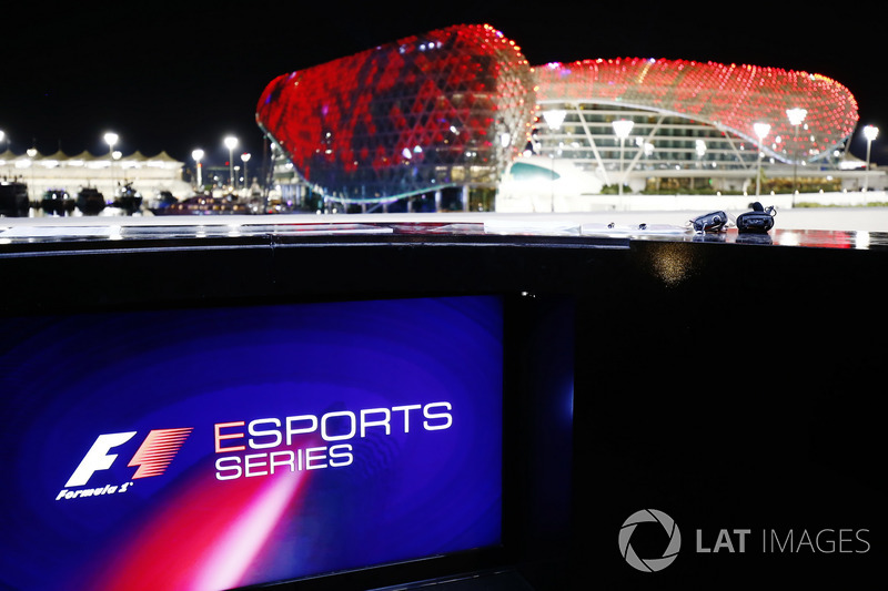 F1 Esport logo on a screen, the circuit buildings in the background