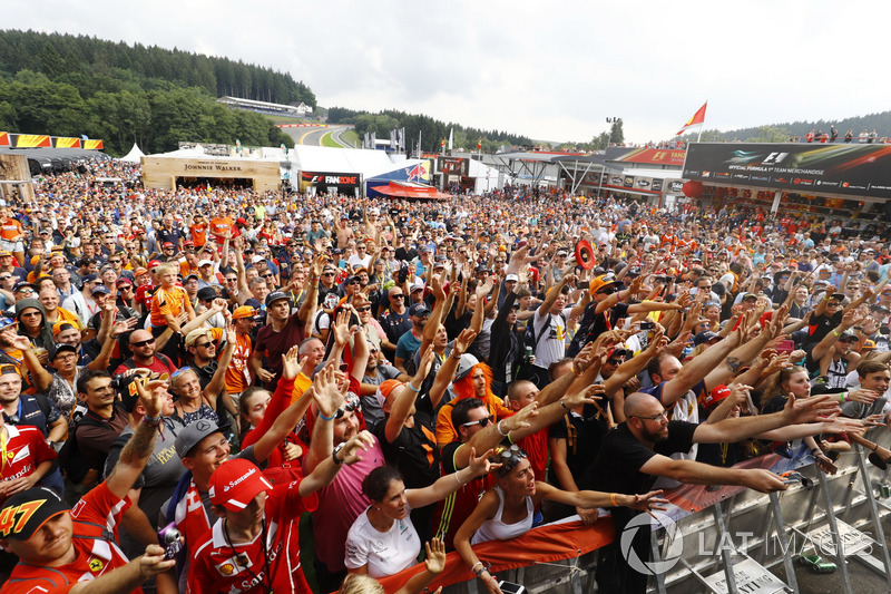 Fans gather around the stage in the F1 Fanzone