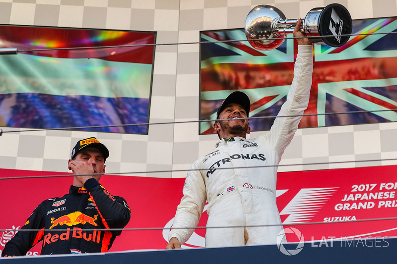 Race winner Lewis Hamilton, Mercedes AMG F1 celebrates on the podium with the trophy