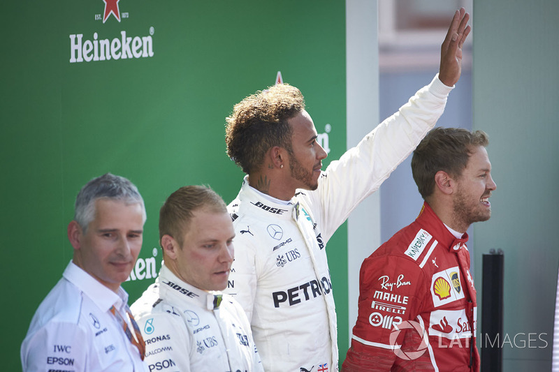 Second place Valtteri Bottas, Mercedes AMG F1, Race winner Third place Lewis Hamilton, Mercedes AMG F1 Sebastian Vettel, Ferrari, on the podium