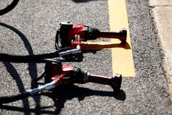 A pair of wheel guns in the pit lane