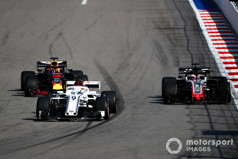 Marcus Ericsson, Sauber C37, leads Romain Grosjean, Haas F1 Team VF-18, and Daniel Ricciardo, Red Bull Racing RB14