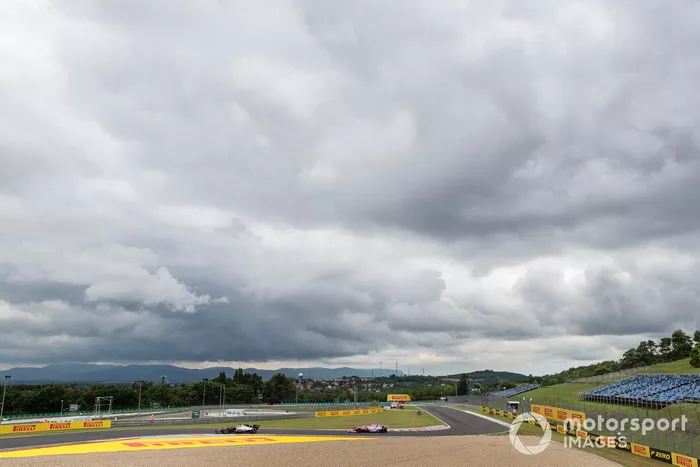 Romain Grosjean, Haas VF-20, leads Lance Stroll, Racing Point RP20