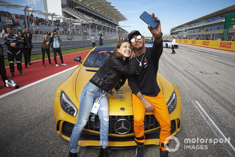 Lewis Hamilton, Mercedes AMG F1, takes a photo with actress Millie Bobby Brown