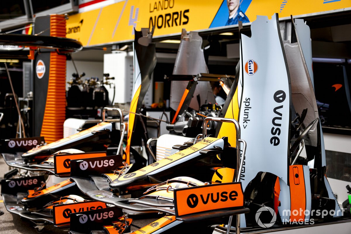 Front wings and bodywork panels outside the McLaren garage