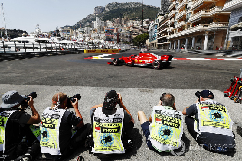 Photographers shoot Sebastian Vettel, Ferrari SF71H