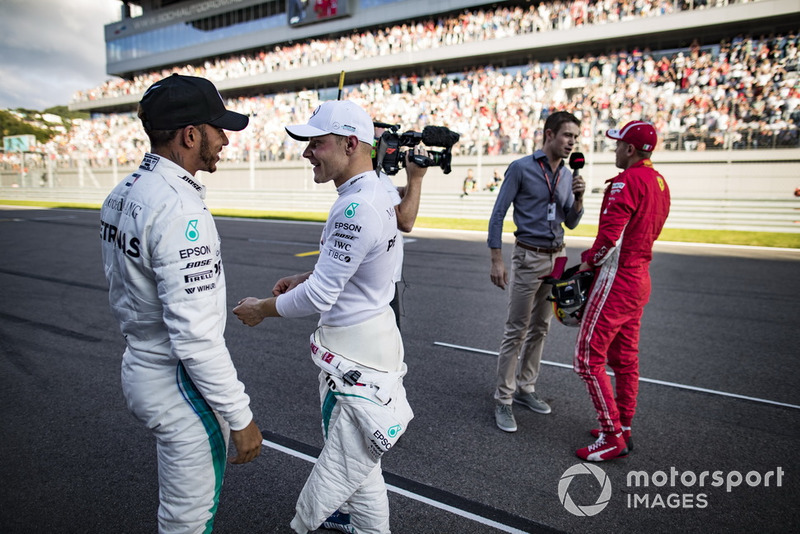 Lewis Hamilton, Mercedes AMG F1, congratulates his team mate Valtteri Bottas, Mercedes AMG F1