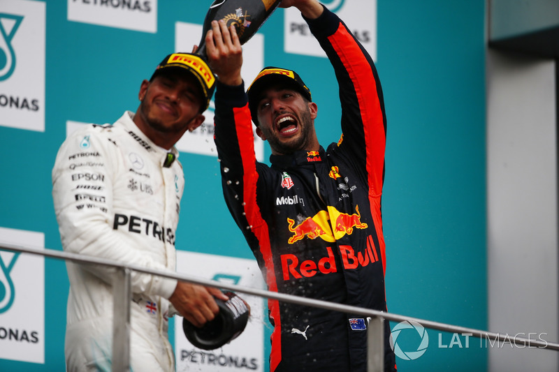 third place Daniel Ricciardo, Red Bull Racing, pours Champagne over second place Lewis Hamilton, Mercedes AMG F1, on the podium
