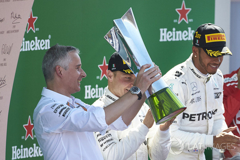 Second place Valtteri Bottas, Mercedes AMG F1, Race winner Lewis Hamilton, Mercedes AMG F1, applaud as the Constructors trophy is presented