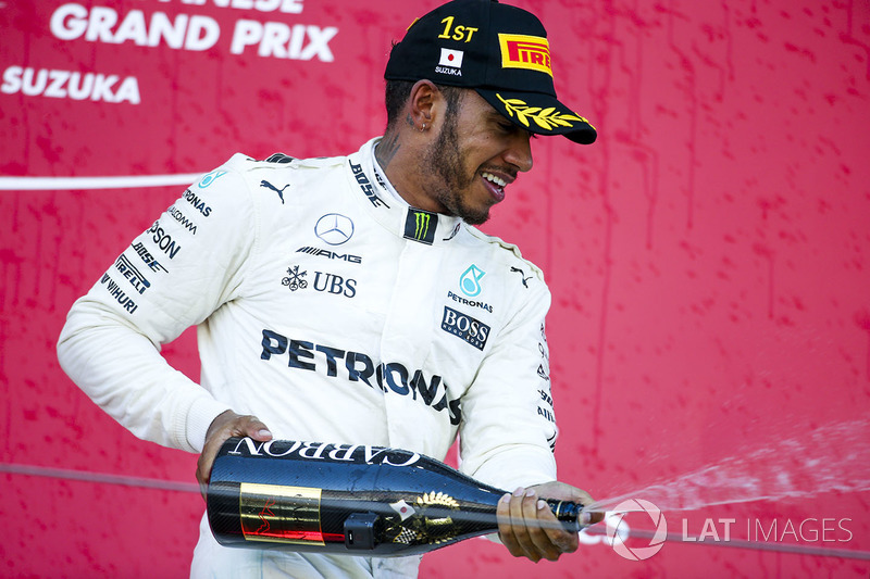 Race winner Lewis Hamilton, Mercedes AMG F1, sprays Champagne on the podium