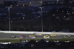 Austin Dillon, Richard Childress Racing Chevrolet Camaro leads as Aric Almirola, Stewart-Haas Racing Ford Fusion wrecks