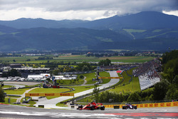 Sebastian Vettel, Ferrari SF71H, leads a Toro Rosso