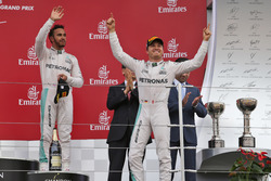 Race winner Nico Rosberg, Mercedes AMG F1 (Right) celebrates on the podium with third placed team ma