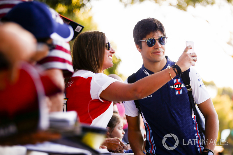 Lance Stroll, Williams Racing, takes a selfie with a fan