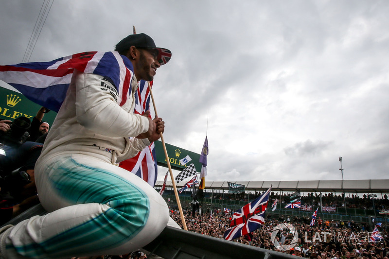 Race winner Lewis Hamilton, Mercedes AMG F1 celebrates with the fans and the union Jack flag