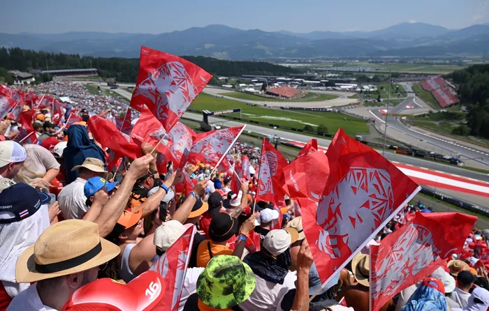 Fans wave flags