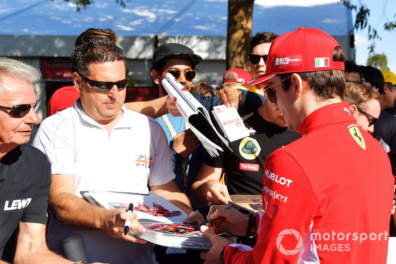 Charles Leclerc, Ferrari, signs an autograph