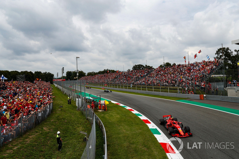 Kimi Raikkonen, Ferrari SF71H, leads Lewis Hamilton, Mercedes AMG F1 W09, and Max Verstappen, Red Bull Racing RB14
