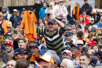 A Dutch fan holds up an orange shirt