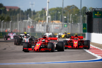 Sebastian Vettel, Ferrari SF71H, leads Kimi Raikkonen, Ferrari SF71H, and Kevin Magnussen, Haas F1 Team VF-18