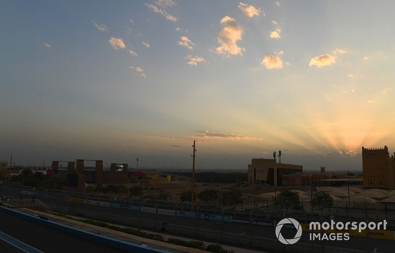 The sun sets over the track