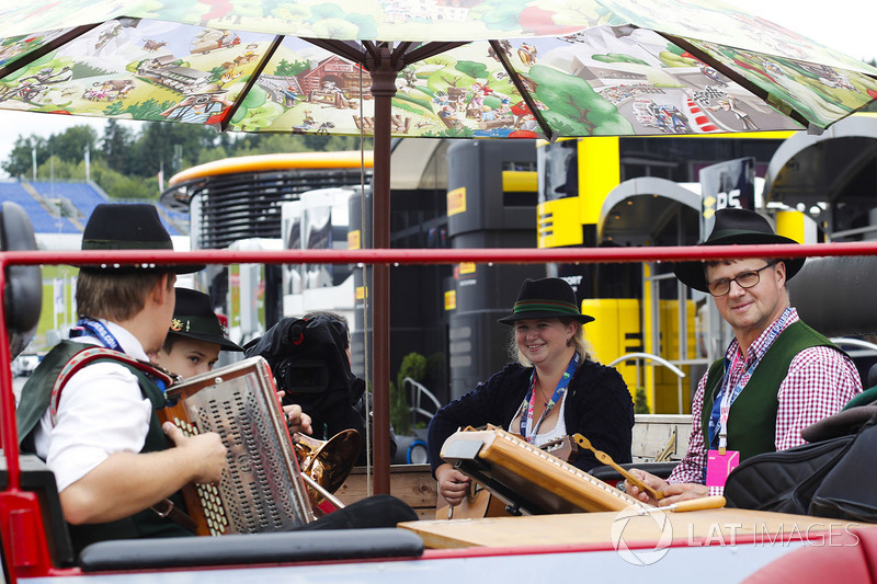 Musicians play in the paddock