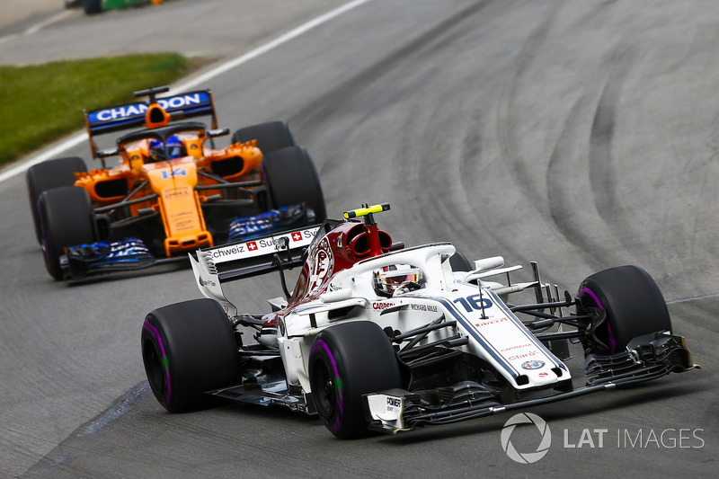Charles Leclerc, Sauber C37, leads Fernando Alonso, McLaren MCL33