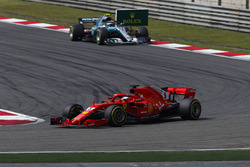 Sebastian Vettel, Ferrari SF71H, leads Valtteri Bottas, Mercedes AMG F1 W09
