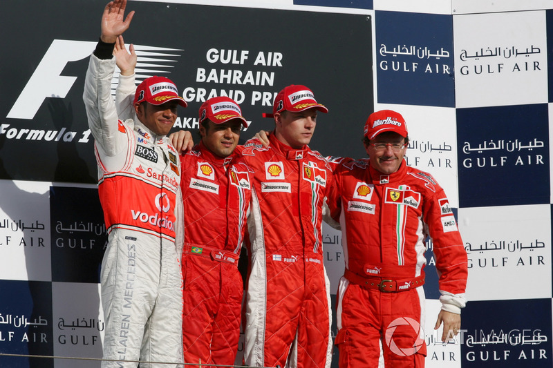 Podium: second place Lewis Hamilton, McLaren, Race winner Felipe Massa, Ferrari, third place Kimi Raikkonen, Ferrari and Luca Baldeseri 