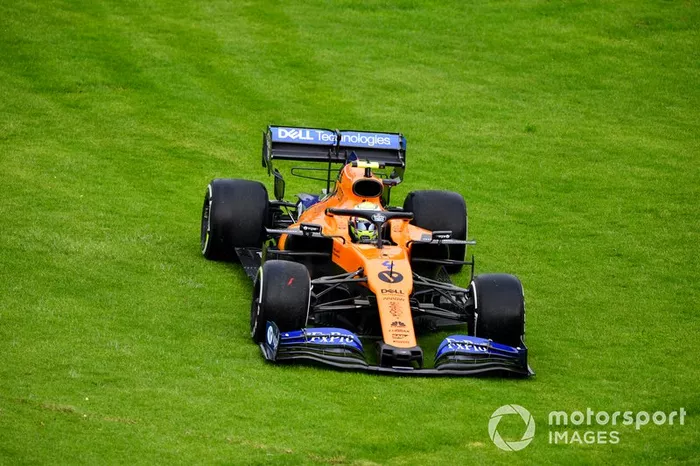 Lando Norris, McLaren MCL34 runs over the grass