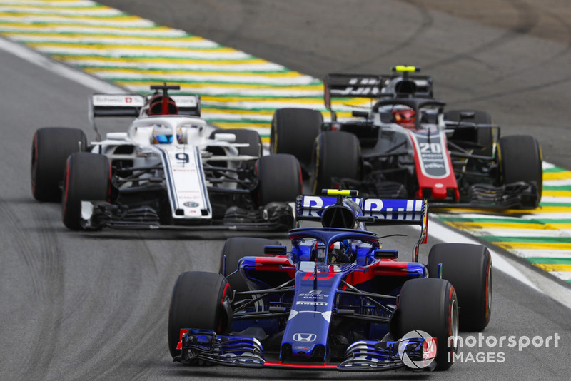 Pierre Gasly, Scuderia Toro Rosso STR13, leads Marcus Ericsson, Sauber C37, and Kevin Magnussen, Haas F1 Team VF-18