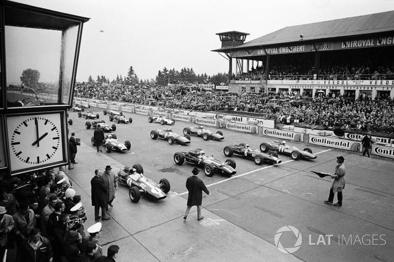 Polesetter Jim Clark, Lotus, John Surtees, Cooper, Jackie Stewart, BRM, and Ludovico Scarfiotti, Ferrari on the front row