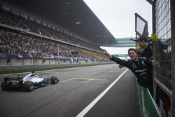 Lewis Hamilton, Mercedes AMG F1 W08, takes the chequered flag