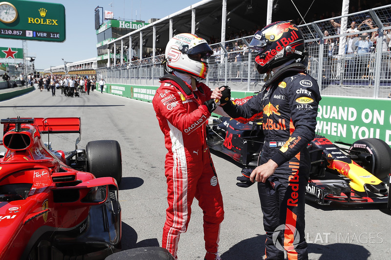 Peraih pole, Sebastian Vettel menyalami Max Verstappen